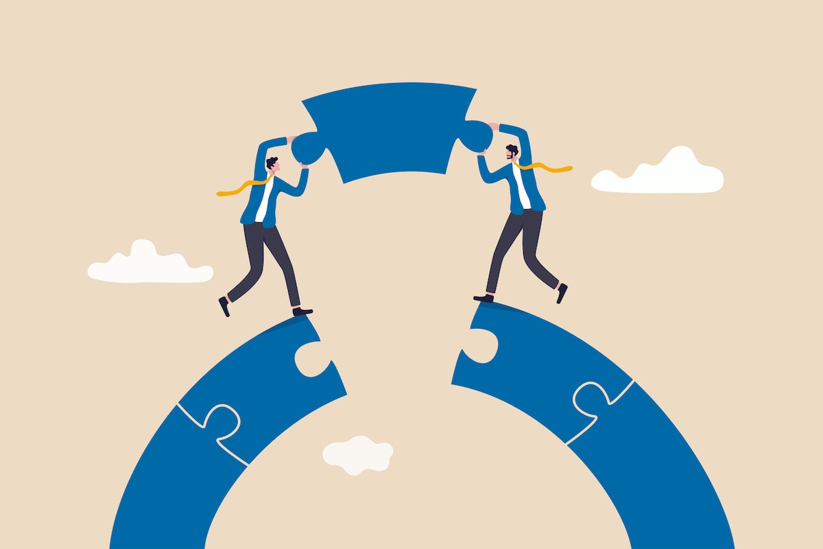 Two businesspeople in suits place the final puzzle piece in a circle, bridging the gap between large puzzle segments, with clouds in the background.