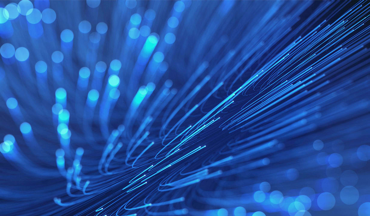 Illustration of blue background filled with vibrant fiber optic lights.