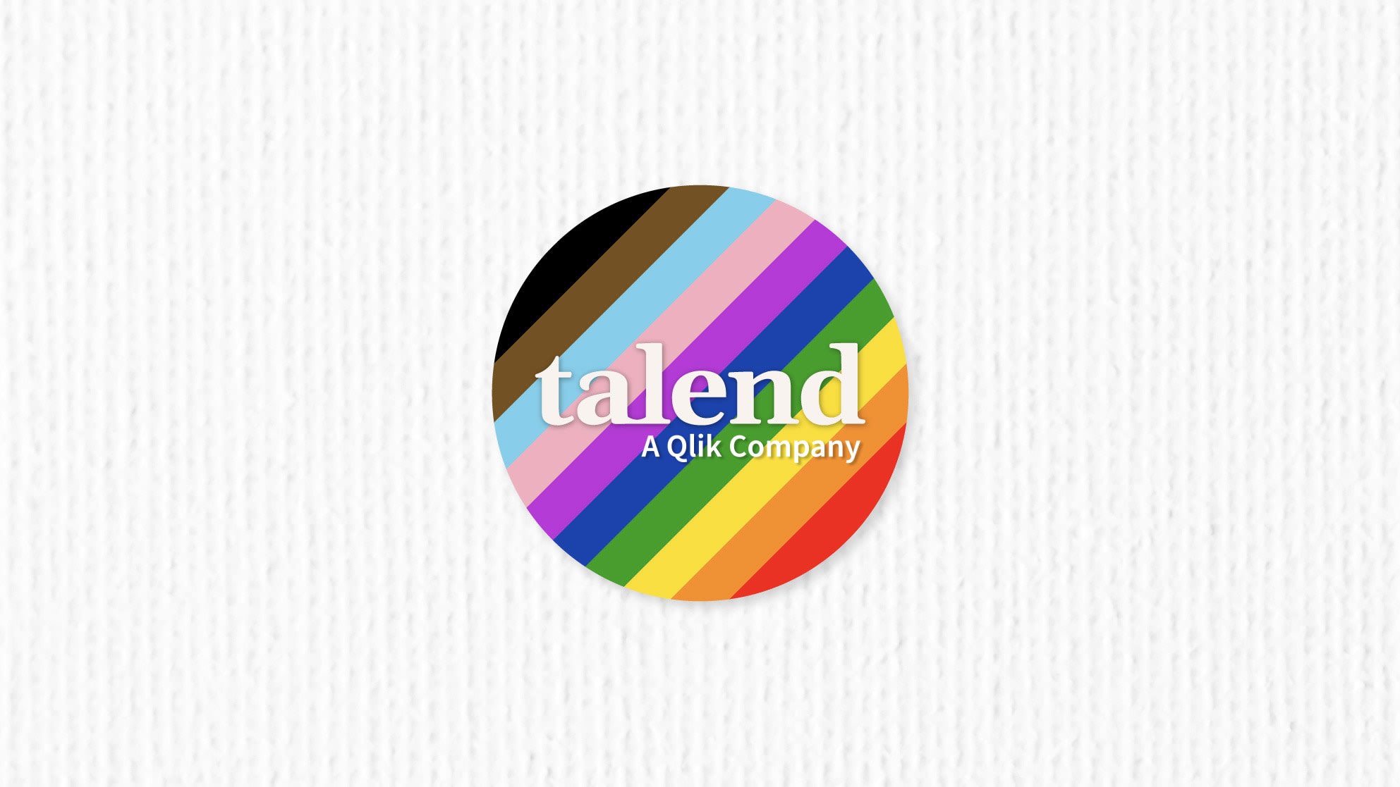 Circular logo with "Talend, A Qlik Company" text, featuring rainbow stripes representing the Pride flag on a white textured background.