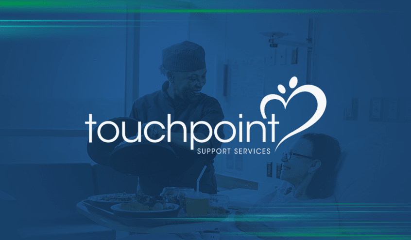 Touchpoint Healthcare logo featuring a nurse serving a food tray to a patient in a hospital bed in the background.